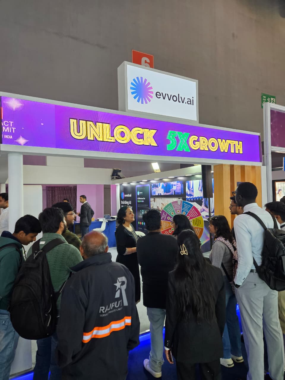 Visitors gathered at the evvolv.ai booth