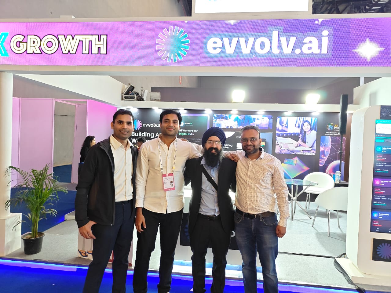 The team talking with visitors at the booth